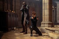 Sey (Omar Sy) and Zee (Nathalie Emmanuel) point guns in The Killer (2024).
