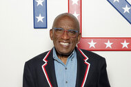 Al Roker smiling in front of a wall.