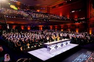 The judges and audience wear white cloths on their heads on America's Got Talent Episode 1908.