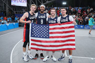 Canyon Barry, Dylan Travis, Jimmer Fredette and Kareem Maddox of Team USA after winning the Gold Medal Game of Men's Basketball 3x3 in 2023