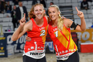 Sara Hughes (R) and Kelly Cheng (L) of United States celebrate after winning the final of women's Volleyball World Beach Pro Tour Finals