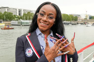 Sha'Carri Richardson on the boat showing her nails off at the 2024 olympics opening ceremony