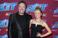 Terry Fator and Darci Lynne stand together on the red carpet during America's Got Talent Season 17 Finale