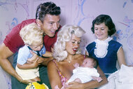 Jayne Mansfield holds her son and is surrounded by her Family