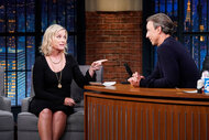 Amy Poehler being interviewed by Seth Meyers on Late Night With Seth Meyers