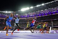 Noah Lyles wins the men's 100-meter in a photo finish at the 2024 Olympics