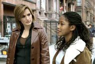 Detective Olivia Benson and Tasha Wright walk together on law and order svu episode 710