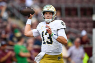 Riley Leonard of the Notre Dame Fighting Irish warms up prior to the game against Texas A&M