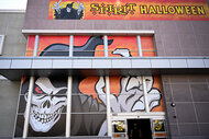 A view of the windows of a Spirit Halloween store front