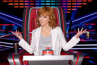 Reba McEntire poses for a photo in her chair during The Voice, Season 26 Episode 1.