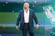 Triple H looks at the crowd on stage during SmackDown