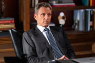 Nicholas Baxter sits at his desk on Law and Order Season 24 Episode 4