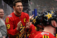 Michael Bublé cheers on Team Hughes from behind the bench during the 2024 Honda NHL All-Star Game