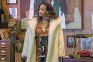 Leola Wheeler (Debbie Allen) wears a white fur coat on Fight Night: The Million Dollar Heist Season 1 Episode 7.