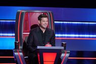 Michael Bublé sits in a judge's chair on The Voice Season 26 Episode 10.