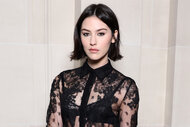 Gracie Abrams wears a lace shirt to fashion week