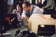 Detective Olivia Benson (Mariska Hargitay) and Detective Elliot Stabler (Christopher Meloni) look closely at a computer screen in Law & Order: Special Victims Unit Episode 105.