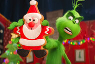 The Grinch (Benedict Cumberbatch) holding up a santa sugar cookie in the animated movie The Grinch (2018)