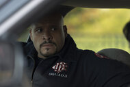 Joe Cruz (Joe Miñoso) sitting in a car in Chicago Fire Season 13, Episode 9.