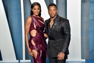 Ciara and Russell Wilson posing together at the Vanity Fair Oscar Party carpet.