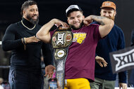 Arizona State Sun Devils' running back Cam Skattebo poses with his MVP belt.