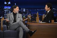 Joe Manganiello wears a grey suit and speaks to Jimmy Fallon on The Tonight Show Starring Jimmy Fallon Episode 2073.