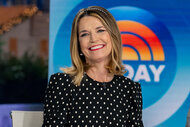 Savannah Guthrie smiles while sitting at the news desk on TODAY