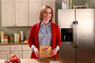 Vanessa Bayer holds up a Totinos box during a sketch on Saturday Nighy Live Season 41, Episode 12