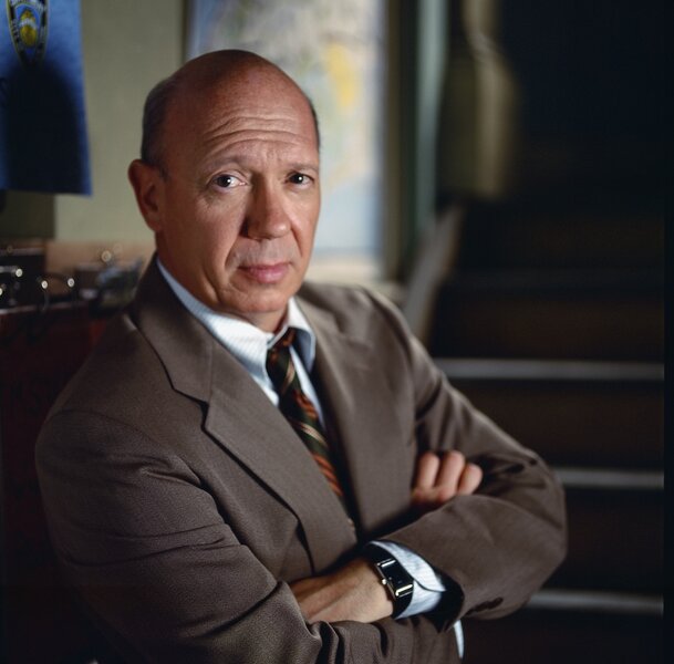 Captain Donald Cragen folds his arms in a suit in Law & Order: Special Victims Unit Season 1.