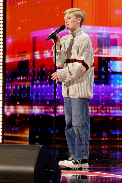 Reid Wilson performs on stage on America's Got Talent Episode 1906