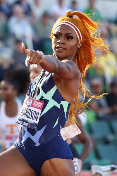 Sha"Carri Richardson points after running the womens 100 Meter of the 2020 U.S. Olympic Track & Field Team Trials