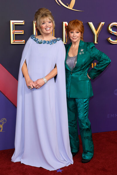 Melissa Peterman and Reba McEntire pose together on the red carpet at the 2024 Emmy Awards