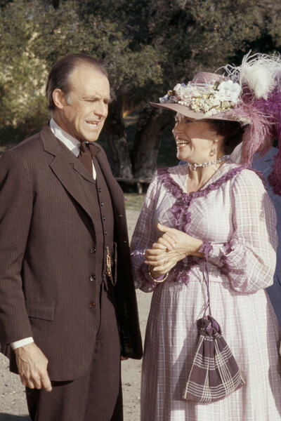 Richard Bull as Nels Oleson and Katherine MacGregor as Harriet Oleson in Little House on the Prairie.