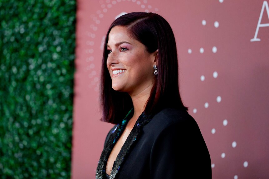 Cassadee Pope posing at the 2021 CMT Artist of the Year red carpet.