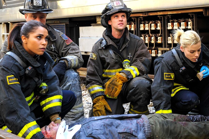 Gabriella Dawson (Monica Raymund), Matthew Casey (Jesse Spencer), and Leslie Shay (Lauren German) in a scene from Chicago Fire.