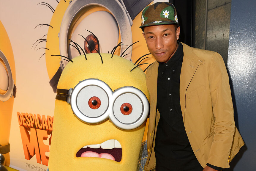 Pharrell and a minion arrive at the premiere of Universal Pictures' "Despicable Me 2"