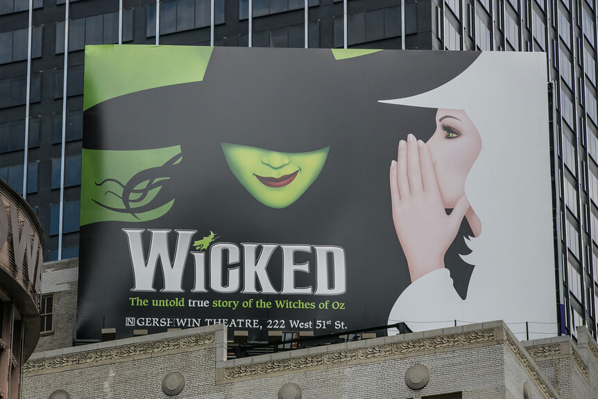 A billboard promotes the Broadway play "Wicked" in Times Square.