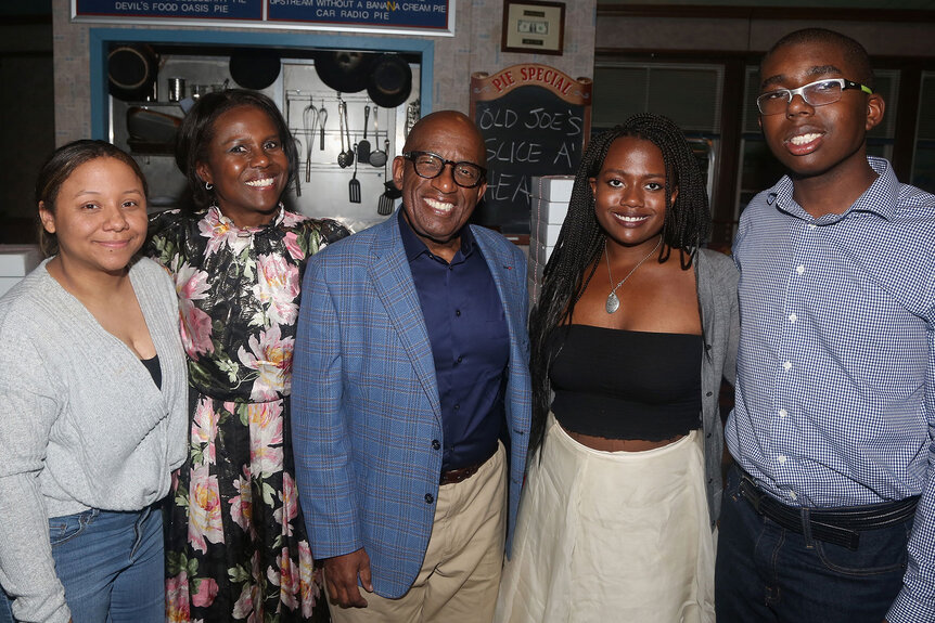 Al Roker and Deborah Roberts pose with their three kids at an event