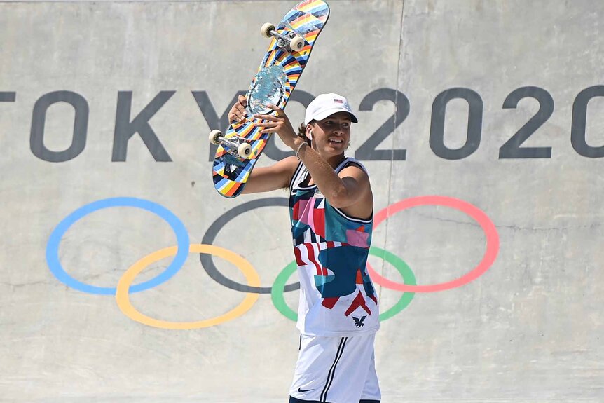 Jagger Eaton holds up his skateboard at the Tokyo 2020 Olympic Games.