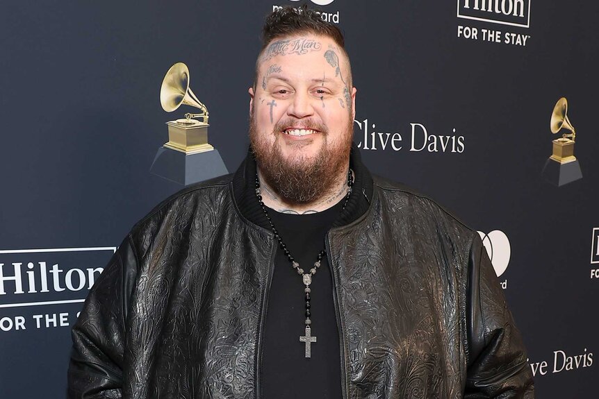 Jelly Roll wears a leather jacket on the red carpet at a the Pre-GRAMMY Gala & GRAMMY party