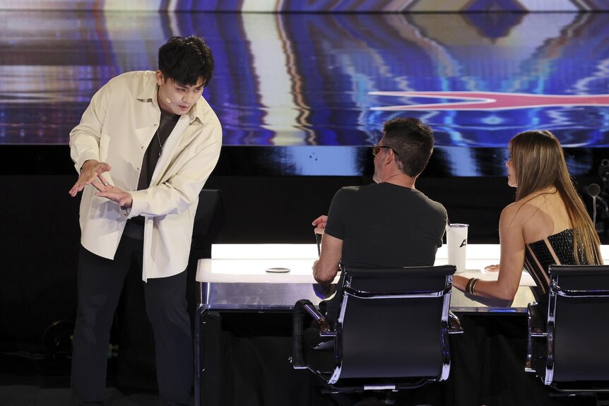 Sam Huang approaches the judges during AGT Episode 1901.