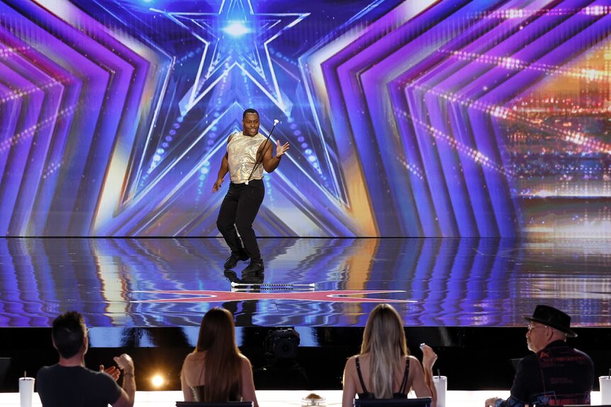 Phillip Lewis performs onstage on America's Got Talent Episode 1902.