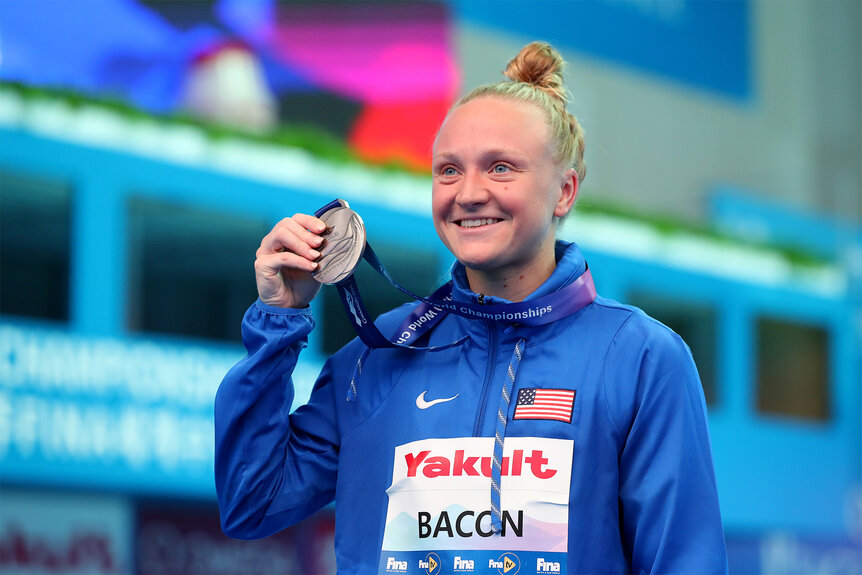 Sarah Bacon holds up her medal during the 2019 FINA World Championships