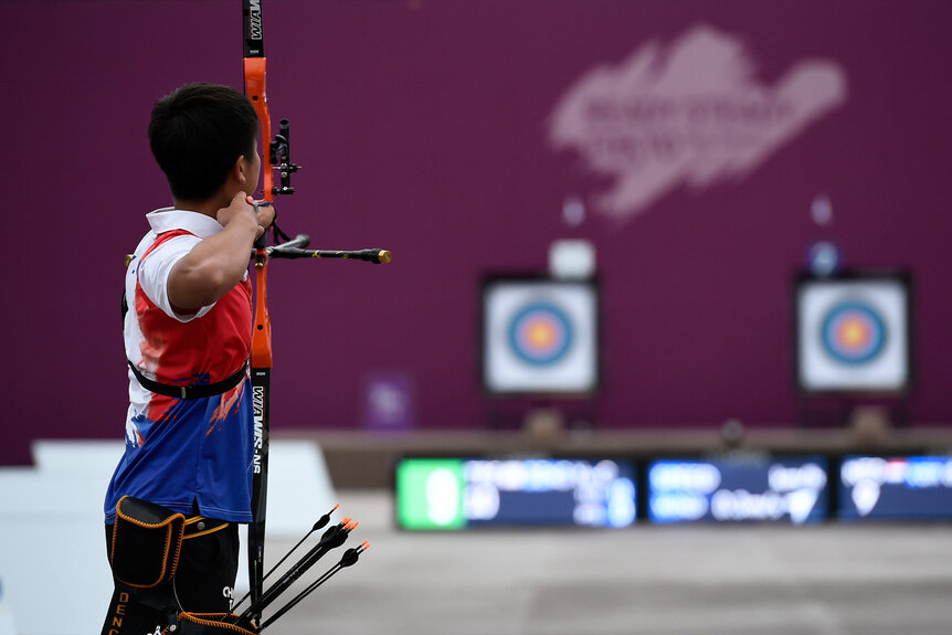 Yu-Cheng Deng aims at the 2019 Ready Steady Tokyo - Archery Olympic test event .