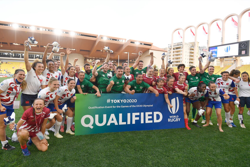 France Women's National Team, Ireland Men's National Team and Russia Women National Team pose with a "Qualified" poster.