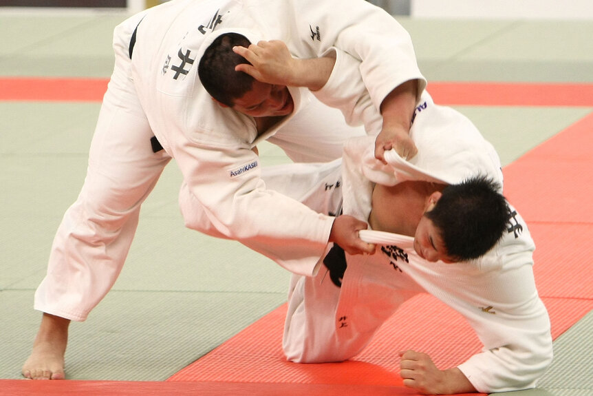 Kosei Inoue and Yohei Takai compete in judo in the All Japan Judo Championship.