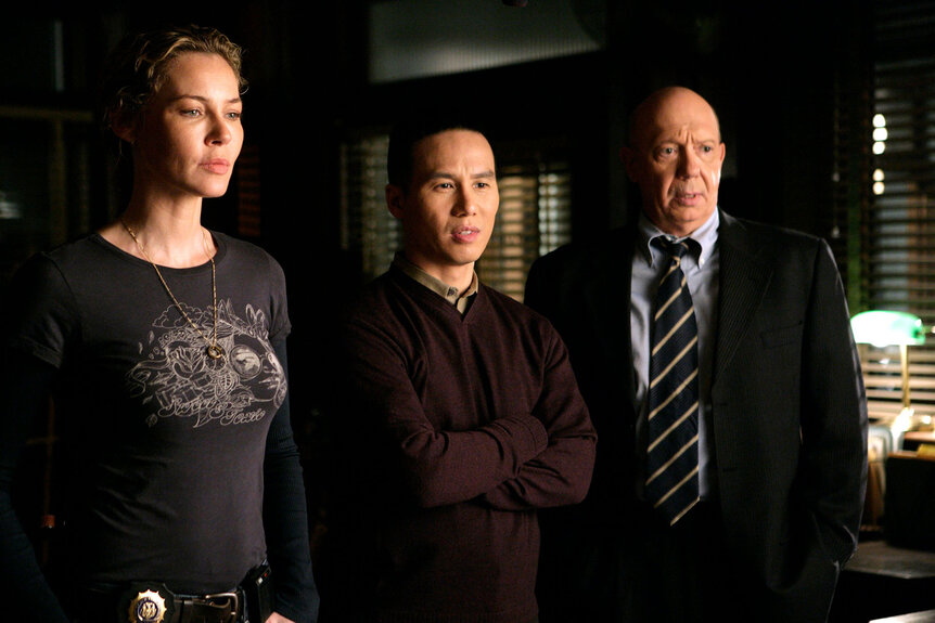 Connie Nielsen as Detective Dani Beck, B.D. Wong as Doctor George Huang, and Dann Florek as Captain Donald Cragen in Law & Order: Special Victims Unit Season 8 Episode 3.