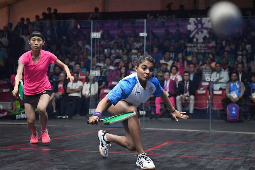 Indias Sunayna Kuruvilla plays squash on a court