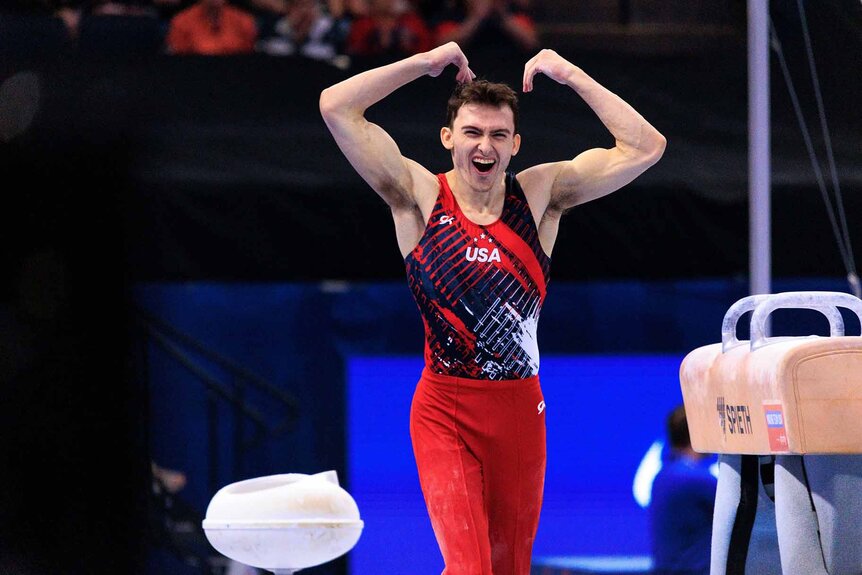 Stephen Nedoroscik raises his arms at the 2024 U.S. Olympic Gymnastics Trials.