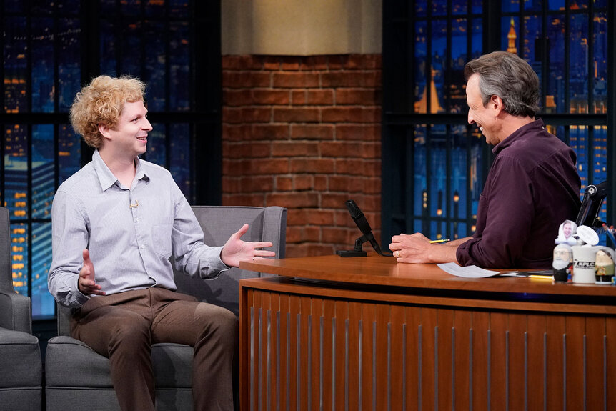 Michael Cera speaks during an interview with Seth Meyers